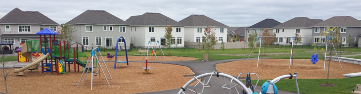 A residential playground with Fibertop Fiber Weave installed